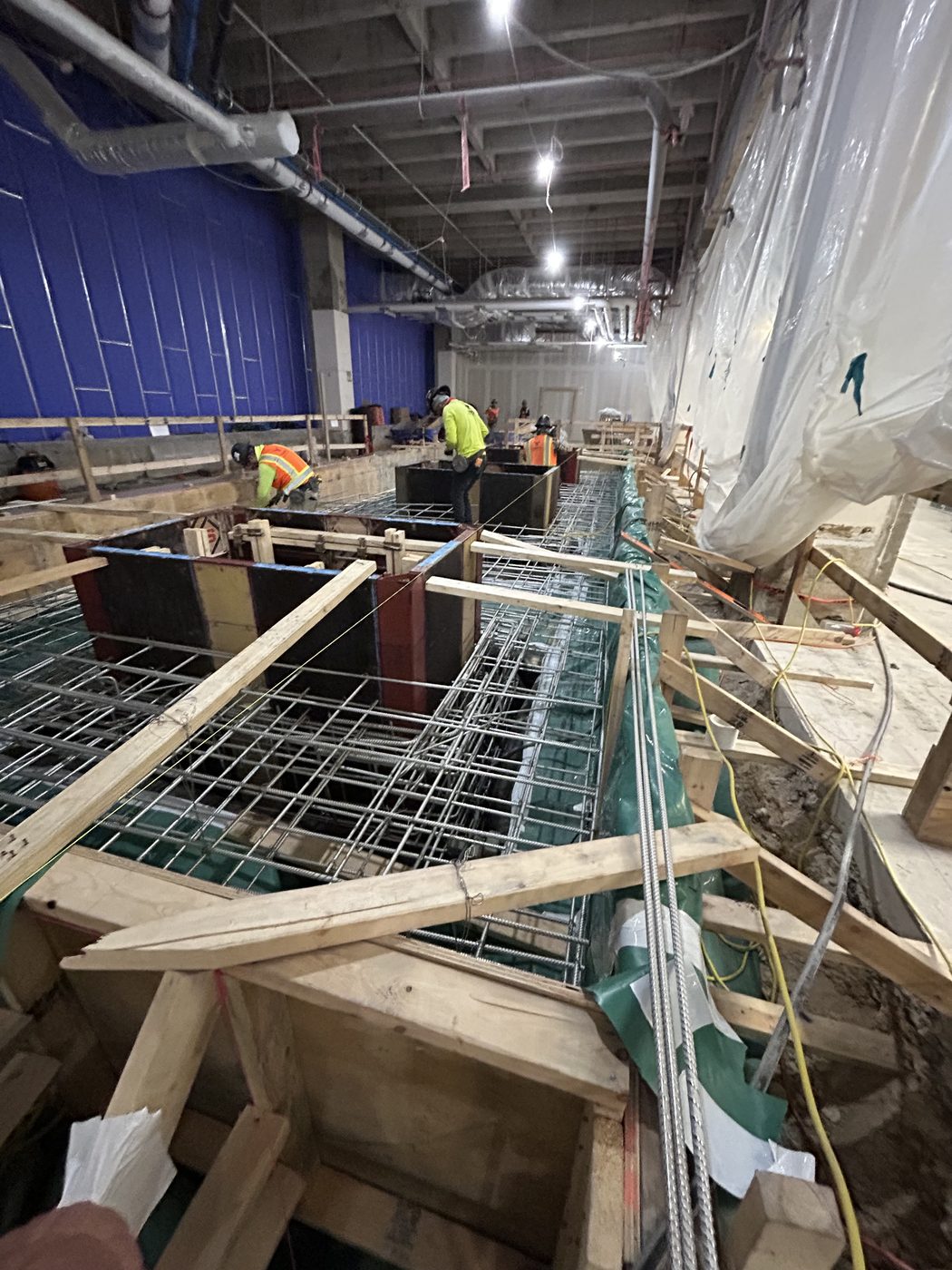 Formwork and rebar placement for a new concrete containment pit at UT Welch Hall